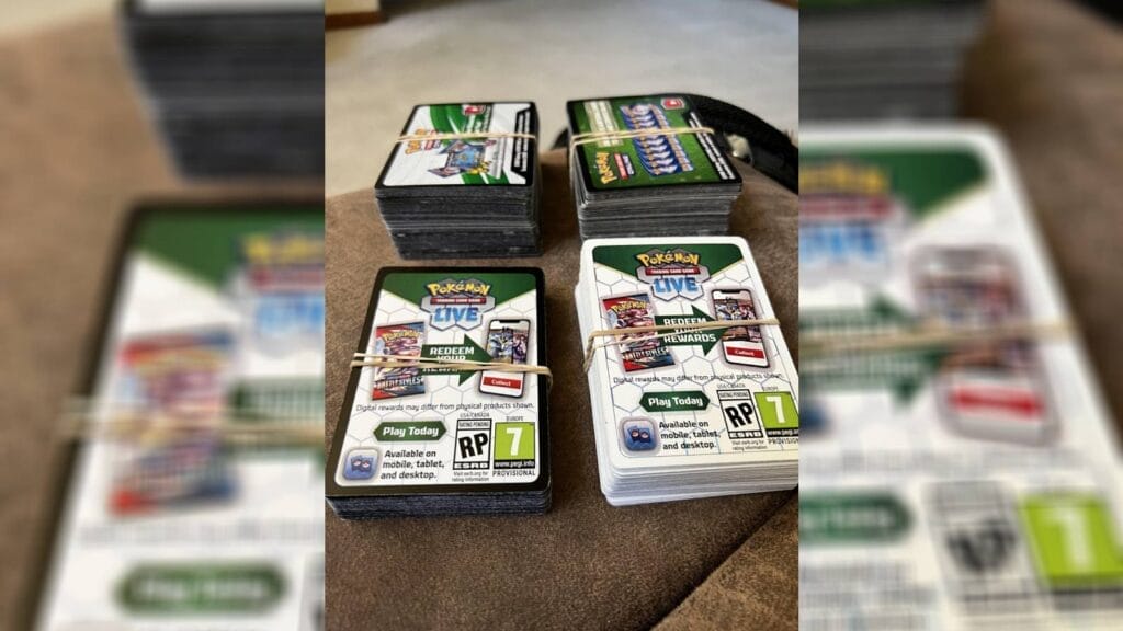 Four Piles Of Code Cards For Pokemon Tcg Live